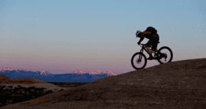 David Aston and His Friend Ricky Burton mountain bike from Durango to Moab during a beautiful sunset