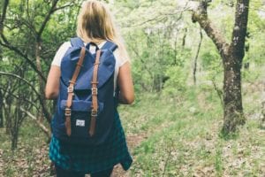 girl with backpack hiking