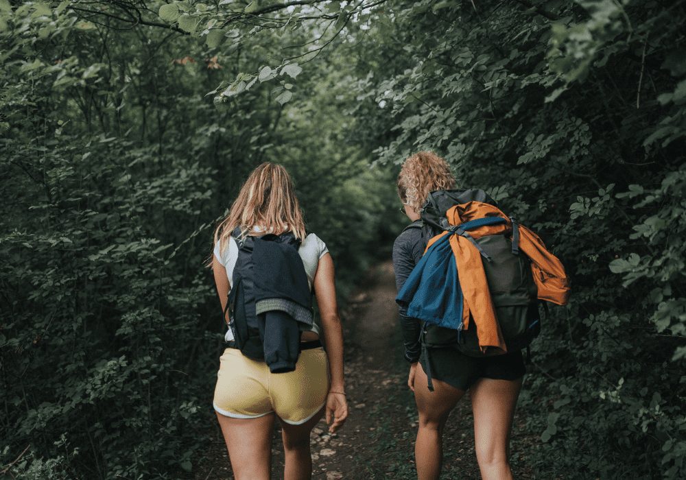 two women with gear on a day hike