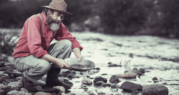 Old man panning for gold