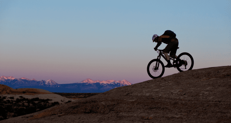 Mountain Biker riding Slickrock Trail in Moab Utah