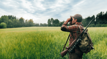 Man Hunting in Georgia USA - scouting his territory with binoculars
