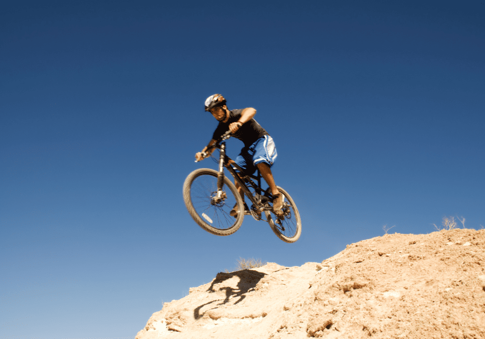 Man Jumping on a mountain bike on a mountain bike trail in Utah
