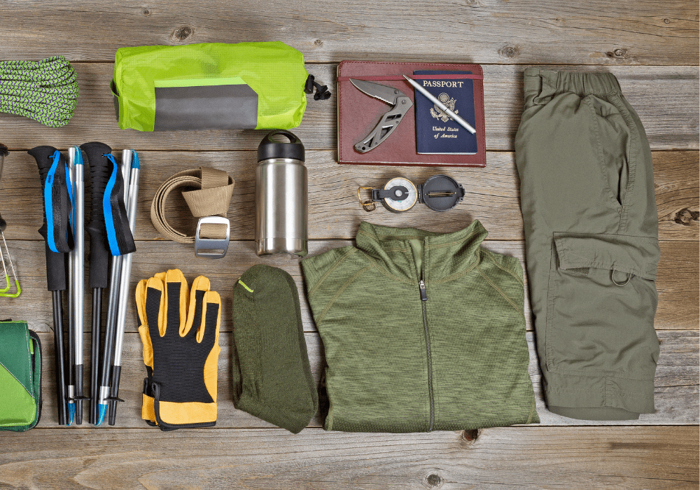 Cold weather gear from our Winter Day Hike Checklist spread on a table