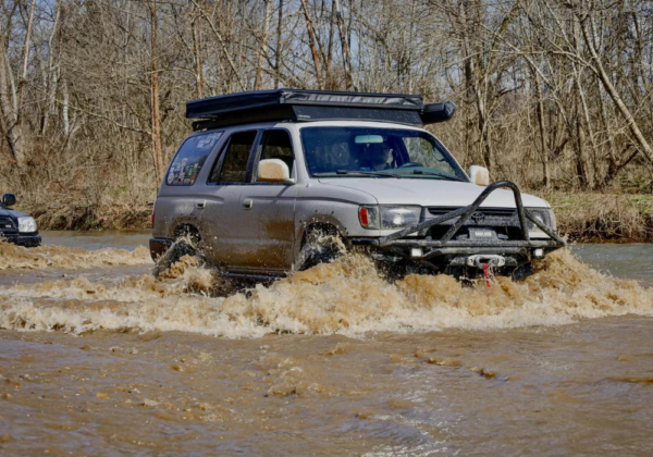 Overlanding Group, with a 4Runner out front Crossing a Dangerous River
