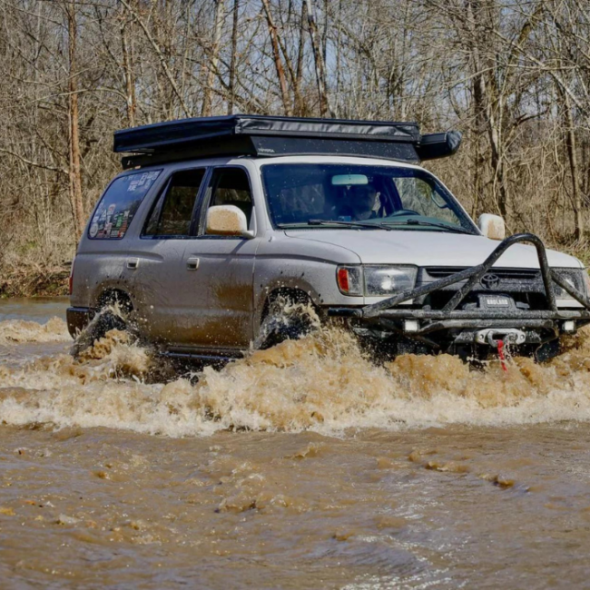 Overlanding Group, with a 4Runner out front Crossing a Dangerous River